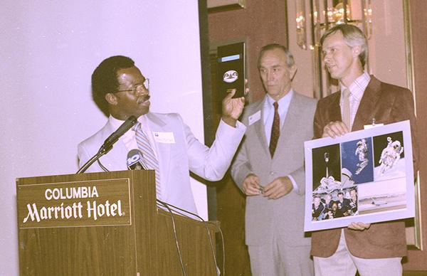 McNair presents his notebook for shuttle mission STS-41B to the State Museum in 1985