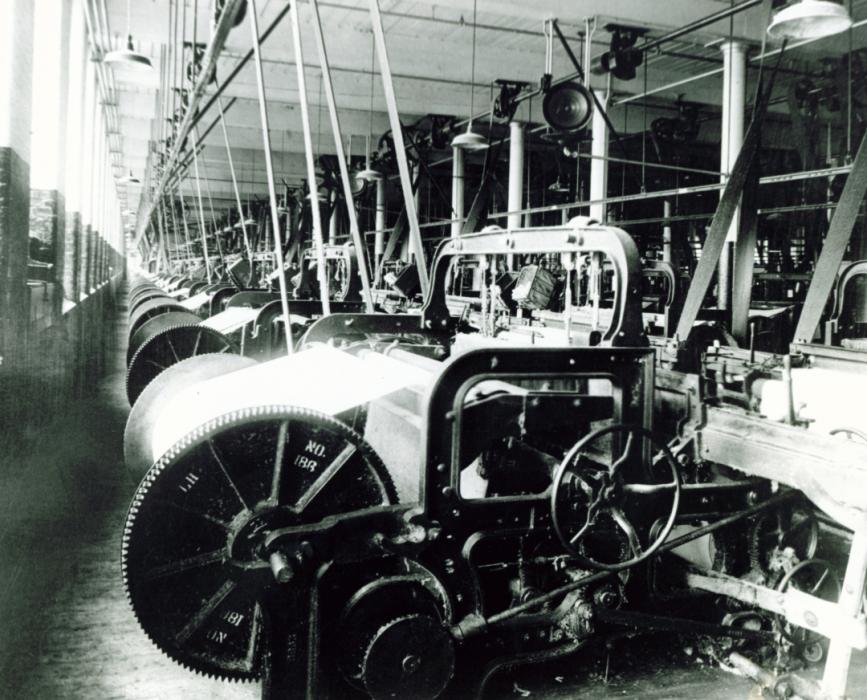 Black and white image of Columbia Mills interior showing loom machinery