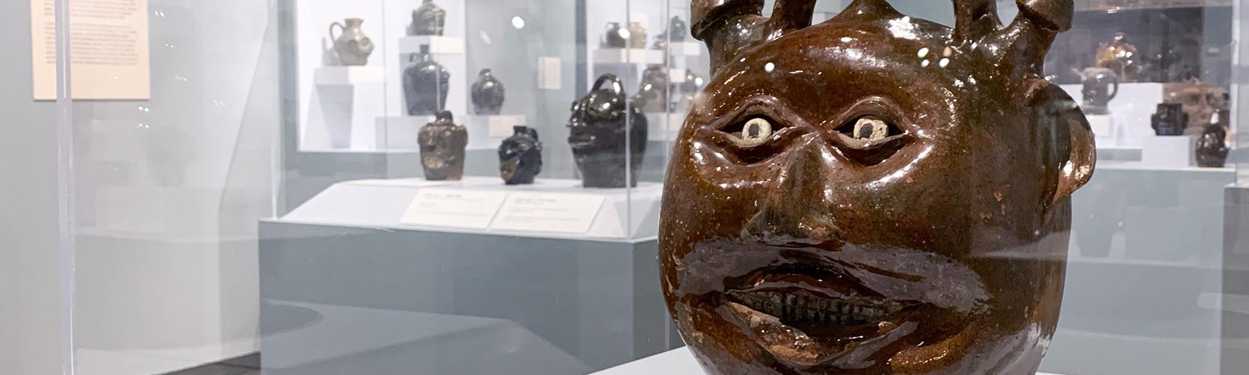 A jug with eyes, nose and mouth.