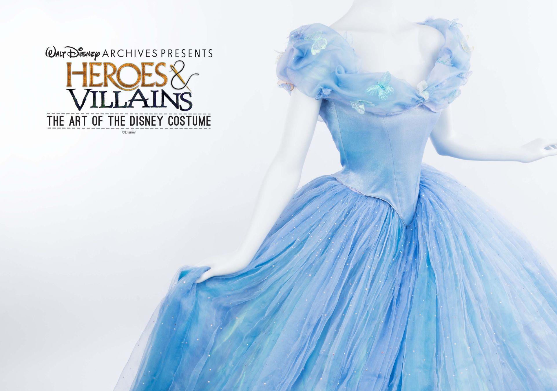 Mannequin on white background wearing light blue off the shoulder ballgown with twirling skite in light blue layers of chiffon.
