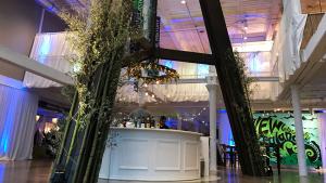 Iconic telescope legs at the South Carolina State Museum are dressed with flowers for a special event.