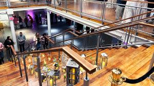 Looking down the main staircase from the mezzanine with stairs decorated with lanterns and candles