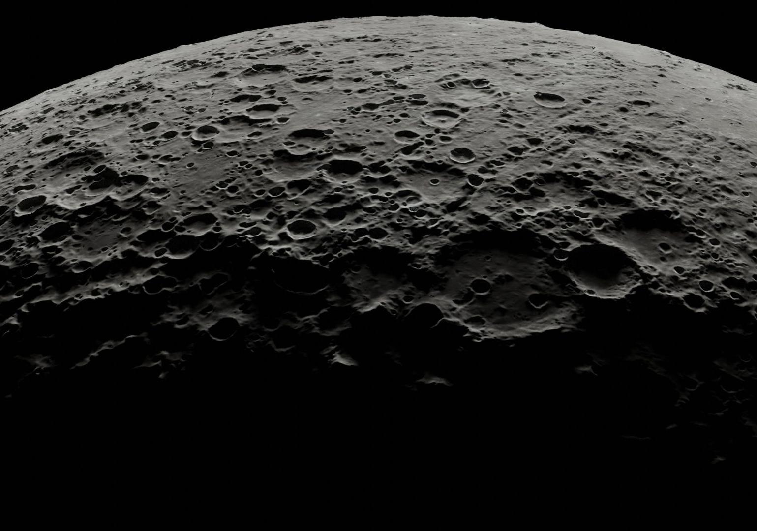 Close up of dark gray cratered surface of the moon 