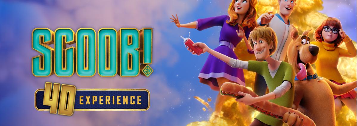 Scooby Doo, Shaggy, Velma, Fred and Daphne characters stand against a cloudy sky