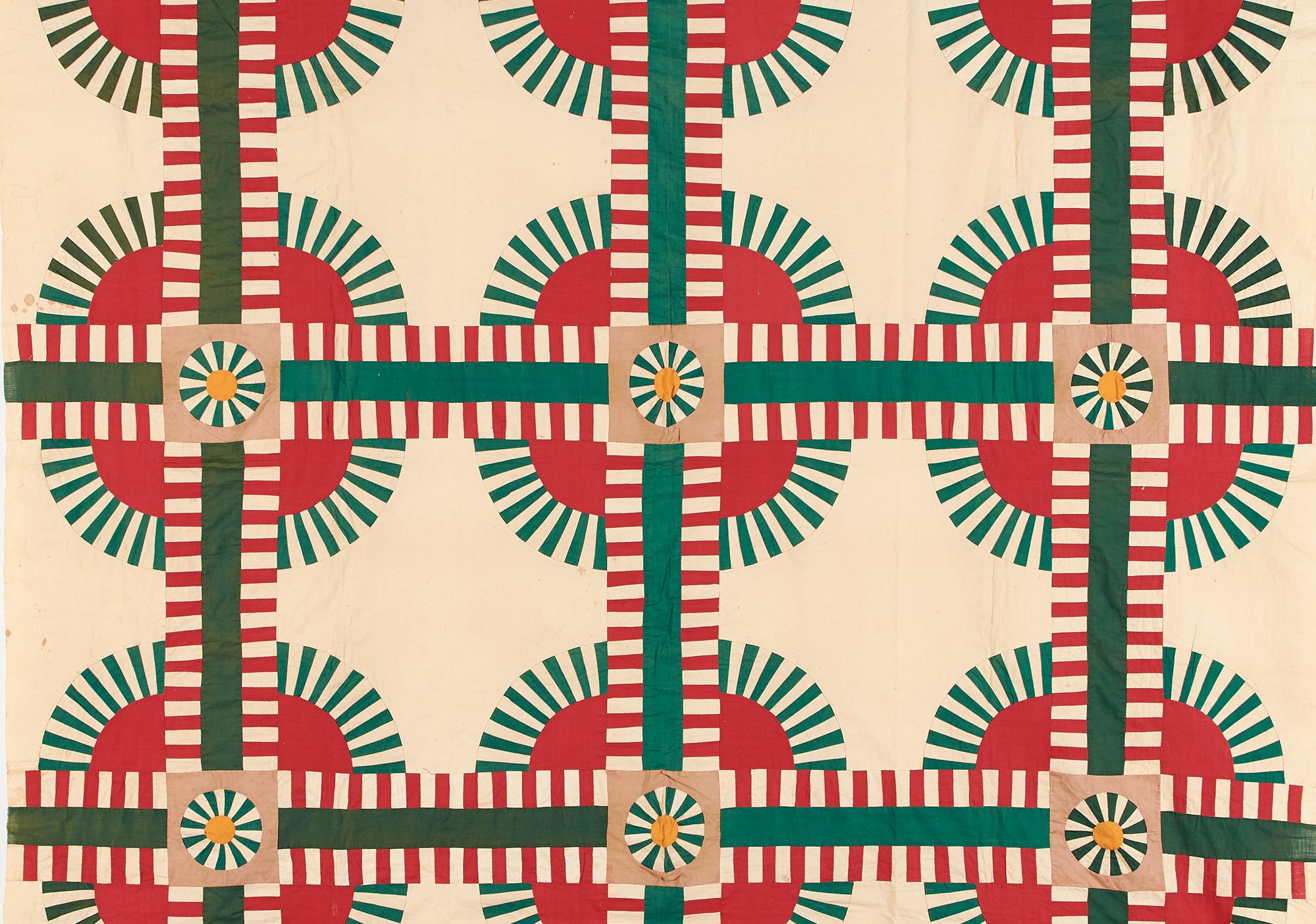 Cream colored quilt with 3-up motif on red circles bordered in radiating outward green dashes that are cross cute with solid green lines trimmed in red dashes.