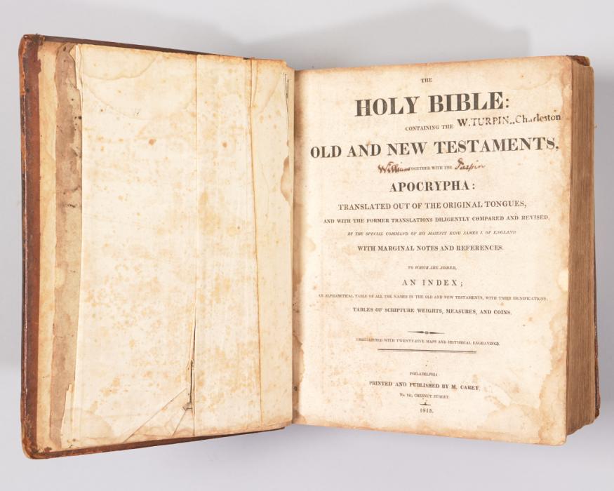 Yellowed page from old book with handwritten text that reads "Slaves Set Free by William Turpin" followed by a list of names for persons emancipated by Turpin.
