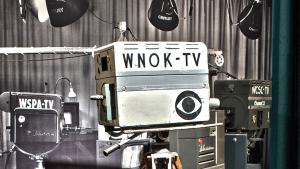 Vintage television camera with WNOK-TV written on the side with the CBS 'eye' logo
