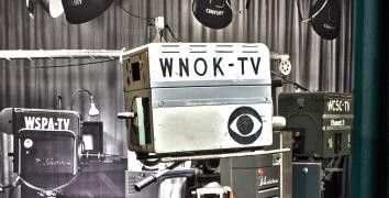 Vintage television camera with WNOK-TV written on the side with the CBS 'eye' logo